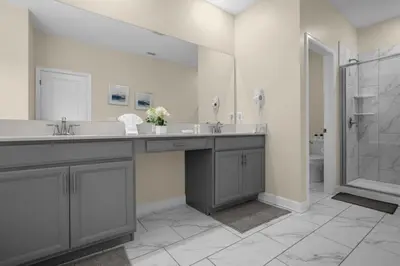 a bathroom with a double sink and a shower at Stylish Resort Home Game Room Poo Near Disney in Kissimmee