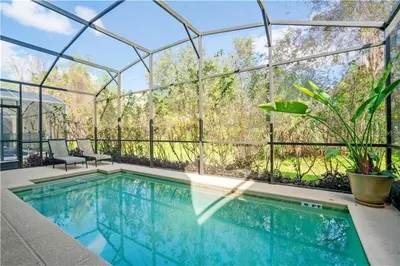 a swimming pool in a glass house with a conservatory at Disney Staycation Pool, Fun Resort Access in Kissimmee