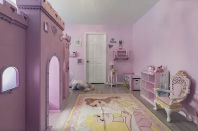 a childs bedroom with a pink room with a horse on the floor at Bright Resort Home Pool Near Disney in Orlando
