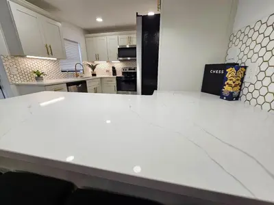 a kitchen with a white counter top in a room at Stylish Duplex walkTO Lake Eola Orlando. Sleeps 8 in Orlando