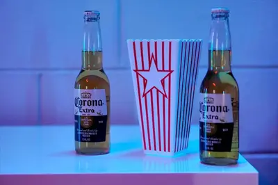 two bottles of corona beer sitting on a table at Family-Friendly 6-Bedroom Villa with Pool Game Room and Themed Bedrooms at Emerald Island Resort in Kissimmee