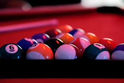 a group of pool balls on a pool table at Family-Friendly 6-Bedroom Villa with Pool Game Room and Themed Bedrooms at Emerald Island Resort in Kissimmee