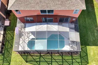 an overhead view of a building with a glass facade at Family-Friendly 6-Bedroom Villa with Pool Game Room and Themed Bedrooms at Emerald Island Resort in Kissimmee