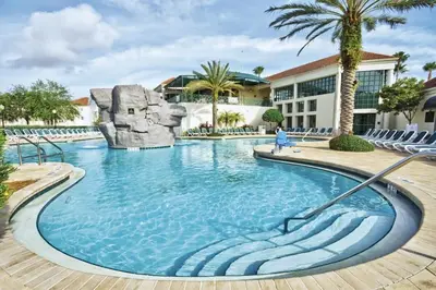 a pool at a resort with a water slide at Wyndham Star Island Resort-1BR- Apartment with Resort Access in Kissimmee