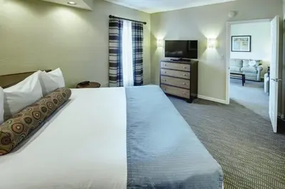 a hotel room with a large bed and a television at Wyndham Star Island Resort-2BR- Apartment with Resort Access in Kissimmee