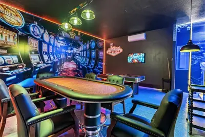 a room with a ping pong table in a casino at Home 08 Bedrooms At Bella Vida in Kissimmee
