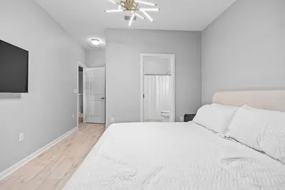 a white bedroom with a bed and a ceiling fan at Home 08 Bedrooms At Bella Vida in Kissimmee