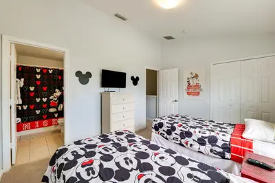 a bedroom with two beds and a tv in it at Family-Friendly Resort Getaway 5 Mi to Disney! in Kissimmee
