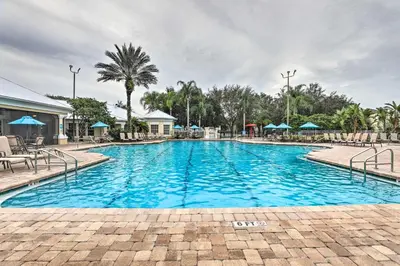a swimming pool at a resort with blue water at Family-Friendly Resort Getaway 5 Mi to Disney! in Kissimmee