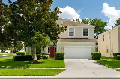 a house with a white garage at Casa 5Q Piscina Resort Windsor Hills Disney in Orlando