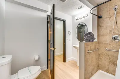 a bathroom with a shower and a toilet at Modern Resort Getaway 9 Mi to Disney Parks! in Kissimmee