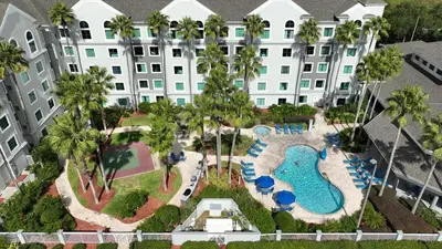 an aerial view of a resort with a swimming pool at Suite near Disney, free parking and shuttle to Parks in Orlando