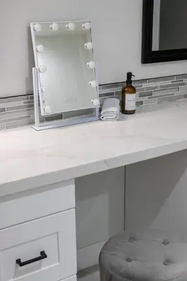 a white counter top with a mirror and a stool at Orlando Lake View Entire Home-NearDowntown in Orlando