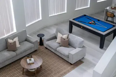 a living room with two couches and a pool table at Orlando Lake View Entire Home-NearDowntown in Orlando