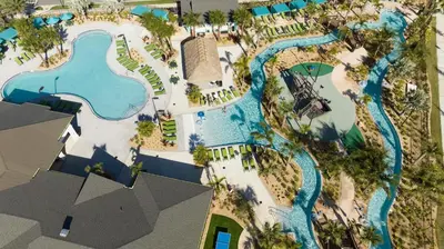 an aerial view of a pool at a resort at Heated Pool Game Room Waterpark 9MI to Disney in Kissimmee