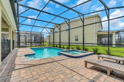 a swimming pool in the middle of a patio at Storey Lake Casa 9Q c Piscina, Cinema e Game Room in Kissimmee