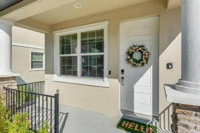 a front door of a house with a wreath on it at 5 Mi to Old Town Kissimmee! Family Escape with Perks in Kissimmee