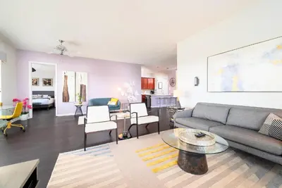a living room with a couch and a table at The Epic Barcelona Penthouse Vista Cay Orlando Florida in Orlando
