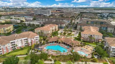 an aerial view of an apartment complex with a swimming pool at The Epic Barcelona Penthouse Vista Cay Orlando Florida in Orlando