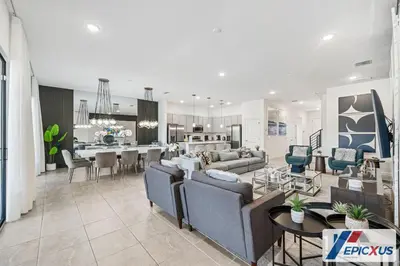 a living room with couches and a dining room at The Epic Venice Paradiso Grande Orlando Florida in Orlando