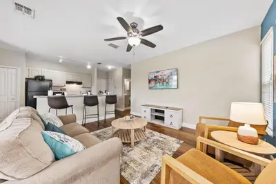 a living room with a couch and a table at 8805 Dunes Court Unit 5-202 in Kissimmee