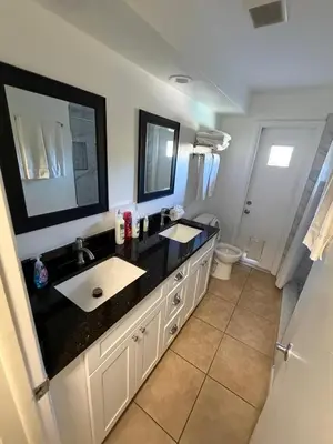 a bathroom with a black counter and a sink at Perfecto Mundo 1, Orlando Area 5BR-2BA Outdoor Pool, Ping Pong, Billiard in Orlando