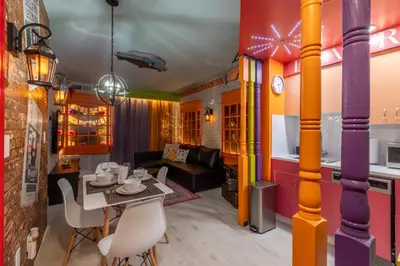 a living room with a table and chairs at Wizard Themed Suite near Universal and Epic in Orlando
