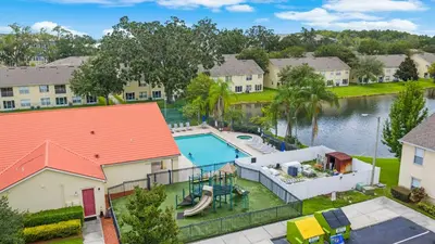 an aerial view of a house with a swimming pool at 2730 Club Cortile Circle Apt. B in Kissimmee