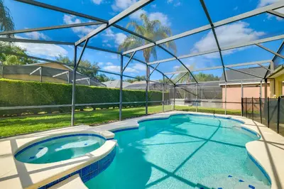 a swimming pool in a house with a glass roof at Peaceful Clermont Gem with Pool, 9 Mi to Disney! in Orlando