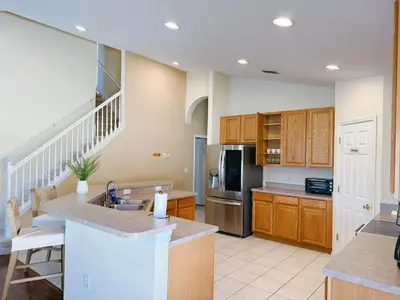 a kitchen with a sink and a counter top at Luxury Family Villa with Pool Near Disney Parks in Kissimmee