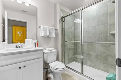 a bathroom with a shower and a toilet and a sink at Brand New 05 Bedrooms At Windsor Cay in Orlando