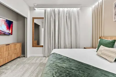 a bedroom with a large bed and a window at Brand New 05 Bedrooms At Windsor Cay in Orlando