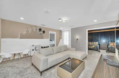 a living room with a white couch and a table at Mahuna Matata in Kissimmee