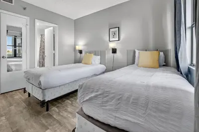 a bedroom with two beds and a window at 6165 CD Unit 3603 - Enclave at Orlando Condo in Orlando