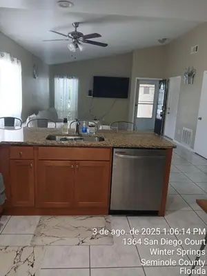 a kitchen with a sink and a counter top at Maxx Maximum Comfort LLC in Orlando