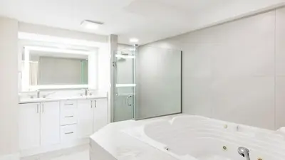 a large white bathroom with a tub and a shower at Westgate Town Center Resort in Orlando