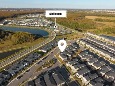 an aerial view of a suburb with a sign that reads clubhouse at 4350 Storey Lake 17 guests near parks poolspa in Kissimmee