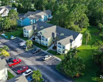 an aerial view of a house with a parking lot at DisneyCondo 10 PP Mr Fredricksen House in Kissimmee