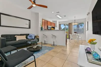 a living room with a couch and a table at Magic Home! GREAT Spot - 15Min Disney20 Universal in Kissimmee