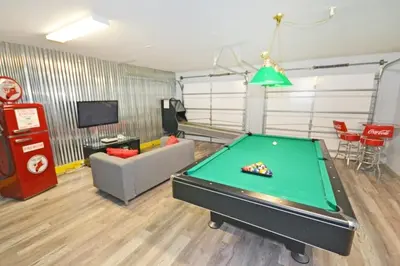 a living room with a pool table in it at Ohana Haven home in Orlando