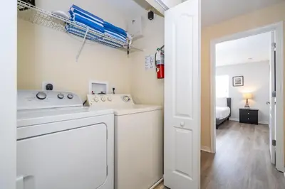 a laundry room with a washer and dryer at Paradise Palms - Spacious house and swimming pool in Kissimmee