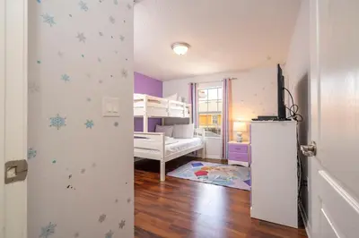 a room with a bedroom with a bunk bed at Paradise Palms - Spacious house and swimming pool in Kissimmee