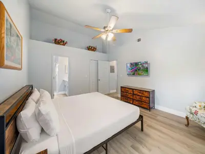 a bedroom with a bed and a ceiling fan at 5005 Laguna Bay Cir 18 in Kissimmee