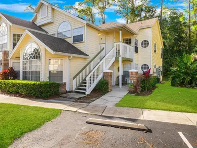 a house with a skateboard in front of it at 5005 Laguna Bay Cir 18 in Kissimmee