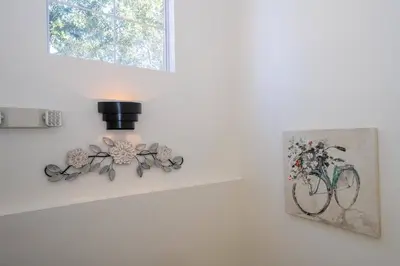 a room with a picture of a bike on the wall at Cozy 4 BR close to Disney in Kissimmee