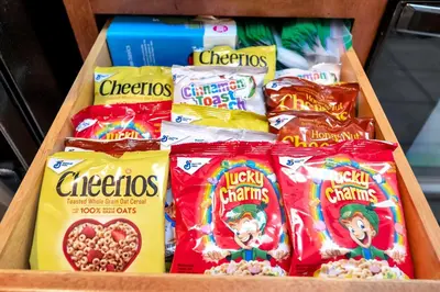 a drawer filled with different types of crisps and cereal at 2BR Fireworks View with Pool & Spa 5 Minutes to Disney in Orlando