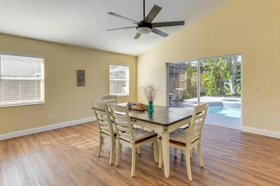 a dining room with a table and chairs and a ceiling fan at Apopka Family Home with Yard, 13 Mi to Dtwn Orlando in Orlando