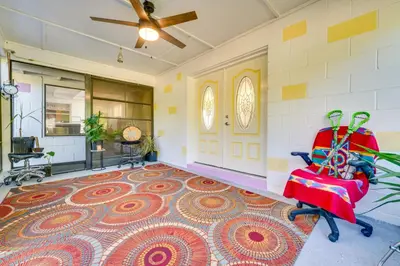 an empty room with a chair and a rug at 1 Mi to Historic Dtwn Sanford! Pet-Friendly Unit in Sanford