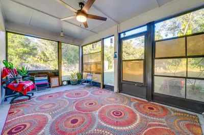 a living room with a large rug on the floor at 1 Mi to Historic Dtwn Sanford! Pet-Friendly Unit in Sanford