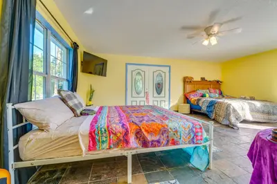 a bedroom with two beds and a ceiling fan at 1 Mi to Historic Dtwn Sanford! Pet-Friendly Unit in Sanford